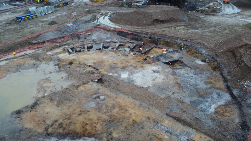 Drone photo showing slots of the ring ditch being excavated